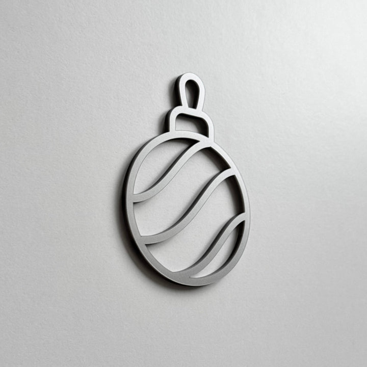 A simple, minimalist silver ornament or ornament-like shape is displayed against a plain white background. A simple, minimalist silver ornament or ornament-like shape is displayed against a plain white background.