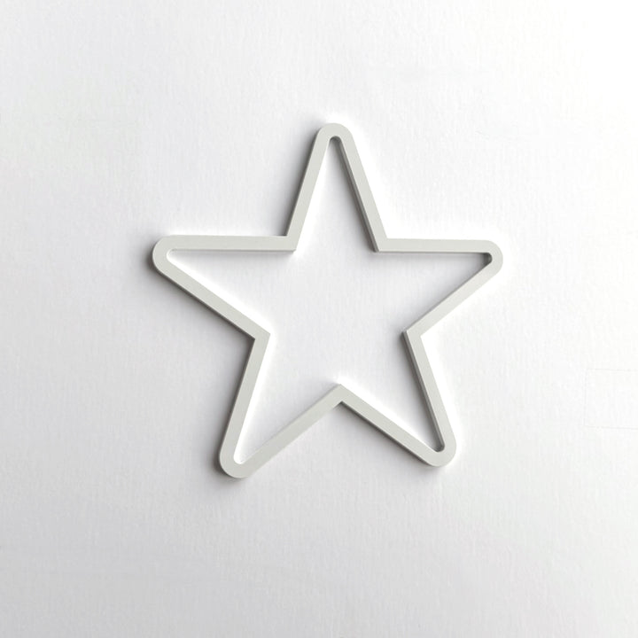 A white star-shaped object is centered against a plain white background. A white star-shaped object is centered against a plain white background.