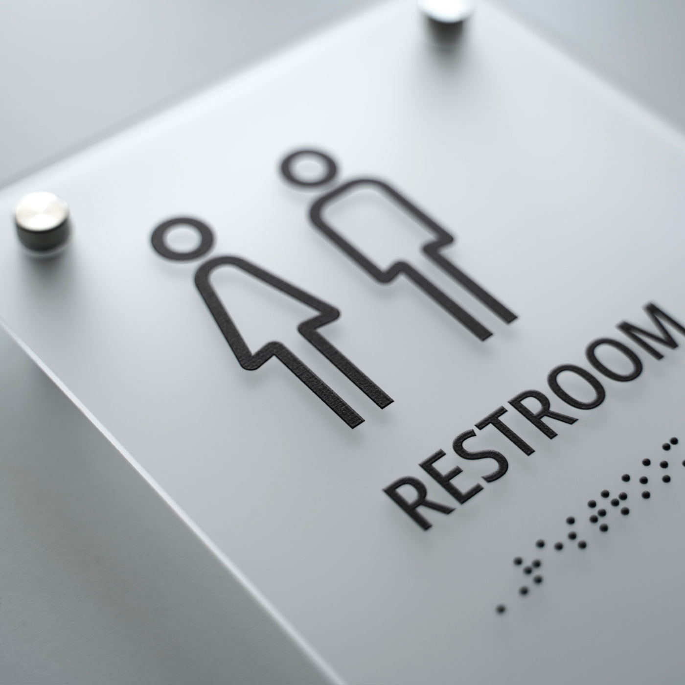 a restroom sign with a man and a woman on it