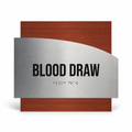 a sign with the text "BLOOD DRAW" in bold black letters, accompanied by a set of Braille text below it. - Photo #1