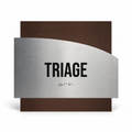 a sign with the word "TRIAGE" prominently displayed in large, bold letters. - Photo #1