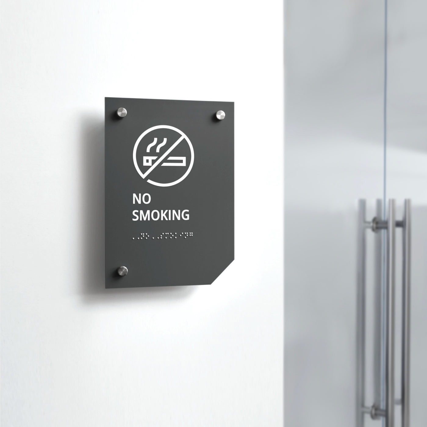 a no smoking sign on a white wall