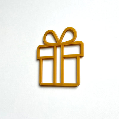 A golden gift box-shaped object is displayed against a white background.