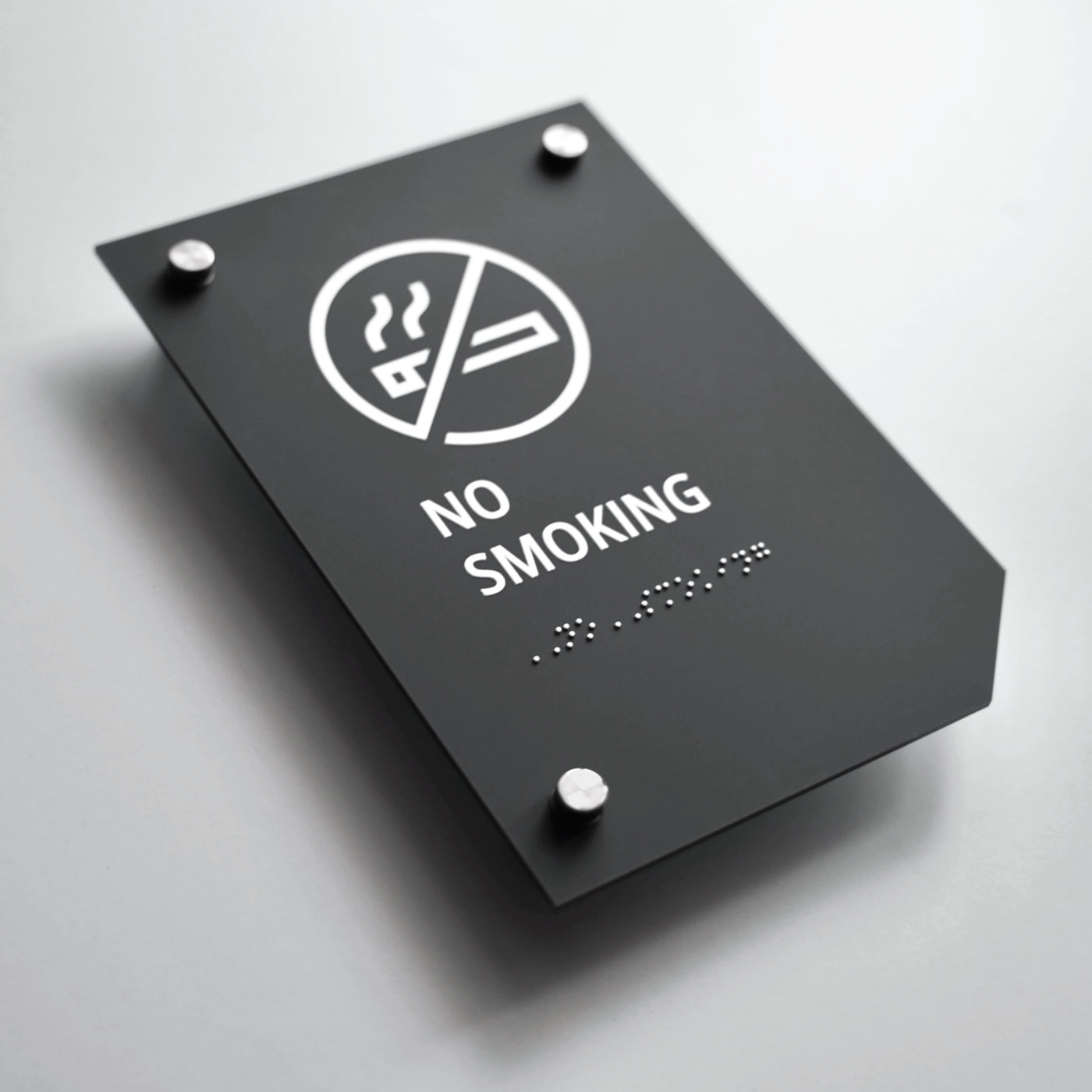 a no smoking sign on a white surface