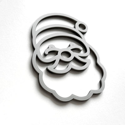 A stylized silhouette of a smiling face, resembling a cartoon or holiday-themed design, is shown against a plain white background.