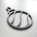 A silver ornament in the shape of a ball with a curved design. - Photo #4