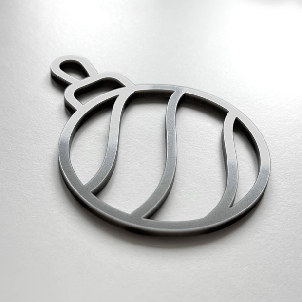 A silver ornament in the shape of a ball with a curved design.