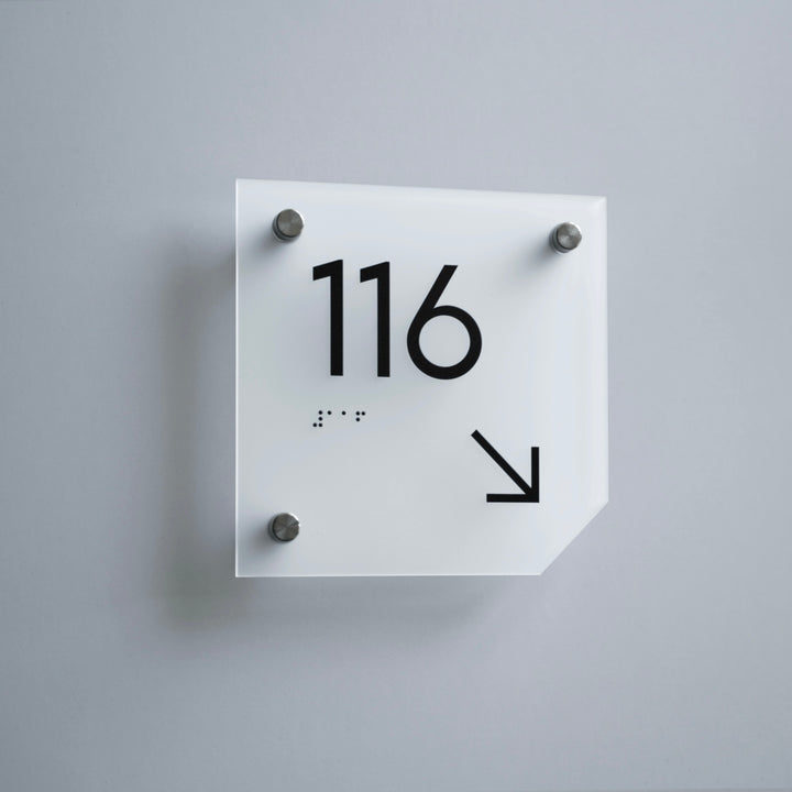 a square white clock with black numbers on it
