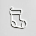 A simple white outline of a stocking on a plain white background. - Photo #1