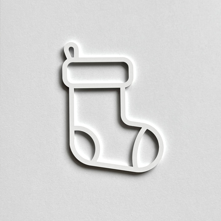A simple white outline of a stocking on a plain white background.