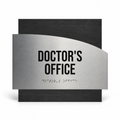 a sign that reads "DOCTOR'S OFFICE" in bold black letters, with a small section of the sign featuring Braille text for the visually impaired. - Photo #1