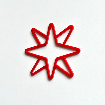 A red star-shaped object is centered against a white background.