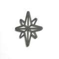 A black star-shaped cutout or stencil is shown against a white background. - Photo #3