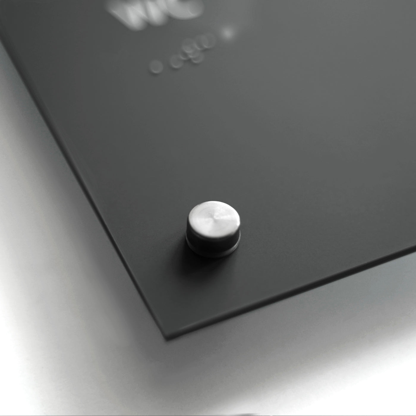 a close up of a button on a black surface