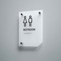 a restroom sign mounted on a wall - Photo #4