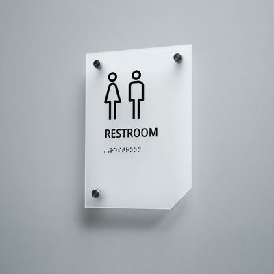 a restroom sign mounted on a wall