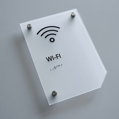 a white sign with a wifi symbol on it