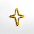 A single, gold-colored star-shaped object is centered against a plain white background. - Photo #7