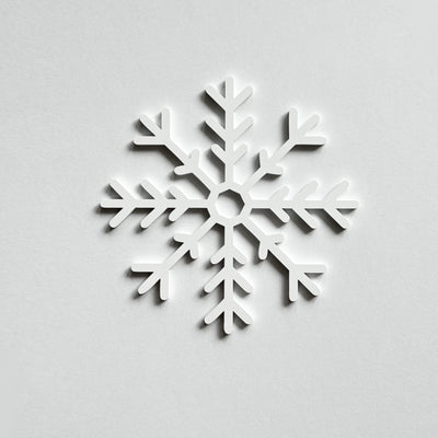 A white snowflake design against a plain white background.