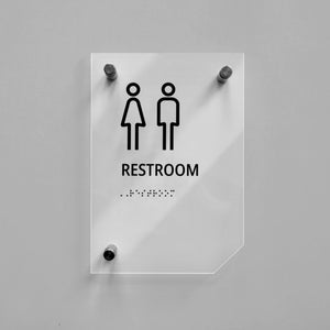 a restroom sign on a white wall