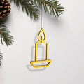 A yellow candle-shaped ornament hangs from a branch, with pine needles and a pine cone visible in the background. - Photo #1