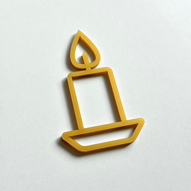 A simple gold candle icon on a white background.