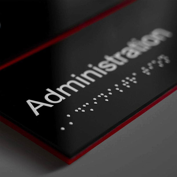 Tactile room identification sign with raised characters and Braille for an administration office