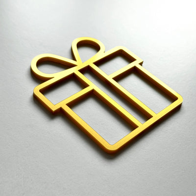 A golden gift box-shaped object is shown against a light background.