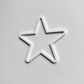 A white star-shaped object is shown against a plain white background. - Photo #7