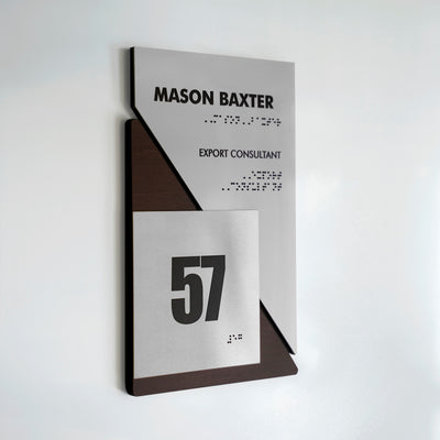 a white wall with a sign that says mason baxter