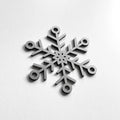 A silver snowflake ornament is displayed against a white background. - Photo #2