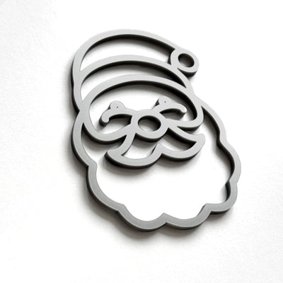 A stylized silhouette of a smiling face, resembling a cartoon or holiday-themed character, is shown against a plain white background.