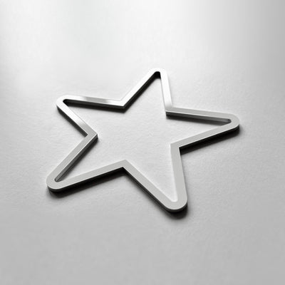 A metallic star-shaped object is shown against a plain white background.
