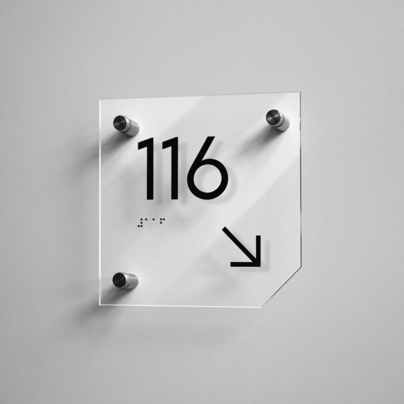 a white clock with a black arrow on it