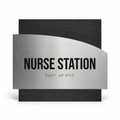a sign that reads "NURSE STATION" with a tactile element indicating the presence of a tactile sign for the visually impaired. - Photo #1