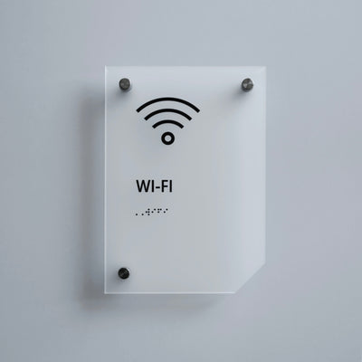 a white sign with a wifi symbol on it