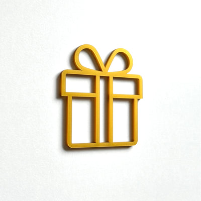 A simple gold-colored gift box icon is displayed against a white background.