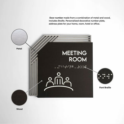 a black and white photo of a meeting room sign