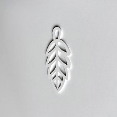 A white leaf-shaped object is centered against a plain white background.