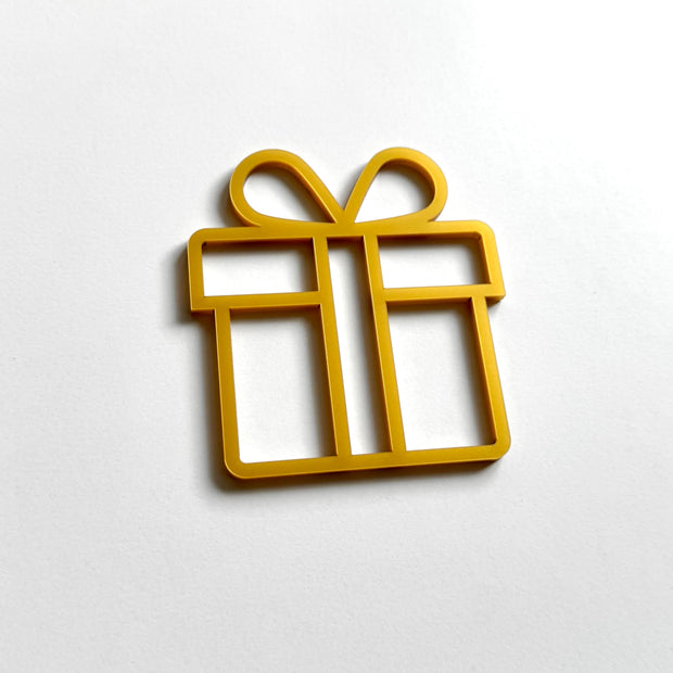 A golden gift box-shaped object is shown against a white background.