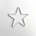 A white star-shaped object is centered against a plain white background. - Photo #1