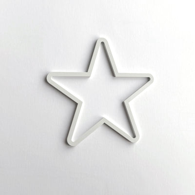 A white star-shaped object is centered against a plain white background.