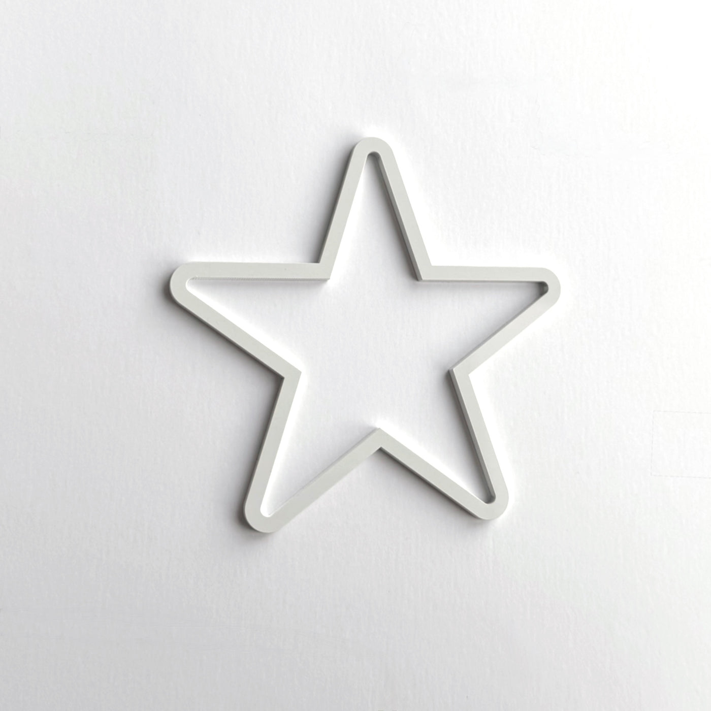 A white star-shaped object is centered against a plain white background.