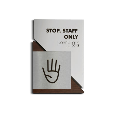 a sign that says stop staff only on it