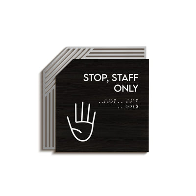 a black and white sign that says stop staff only