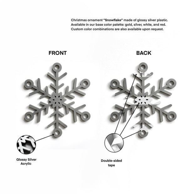 The image is a close-up of a shiny silver snowflake ornament made of glossy silver plastic. It is available in a base color palette of gold, silver, white, and red, and custom color combinations are also available upon request.