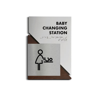 a baby changing station sign on a white background