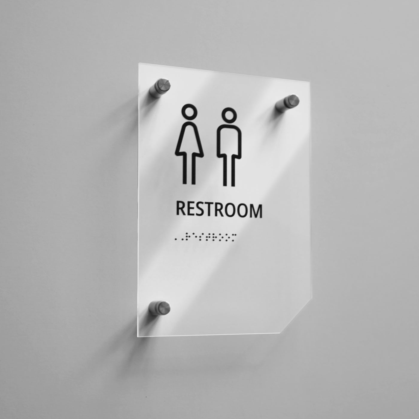 a restroom sign on a white wall