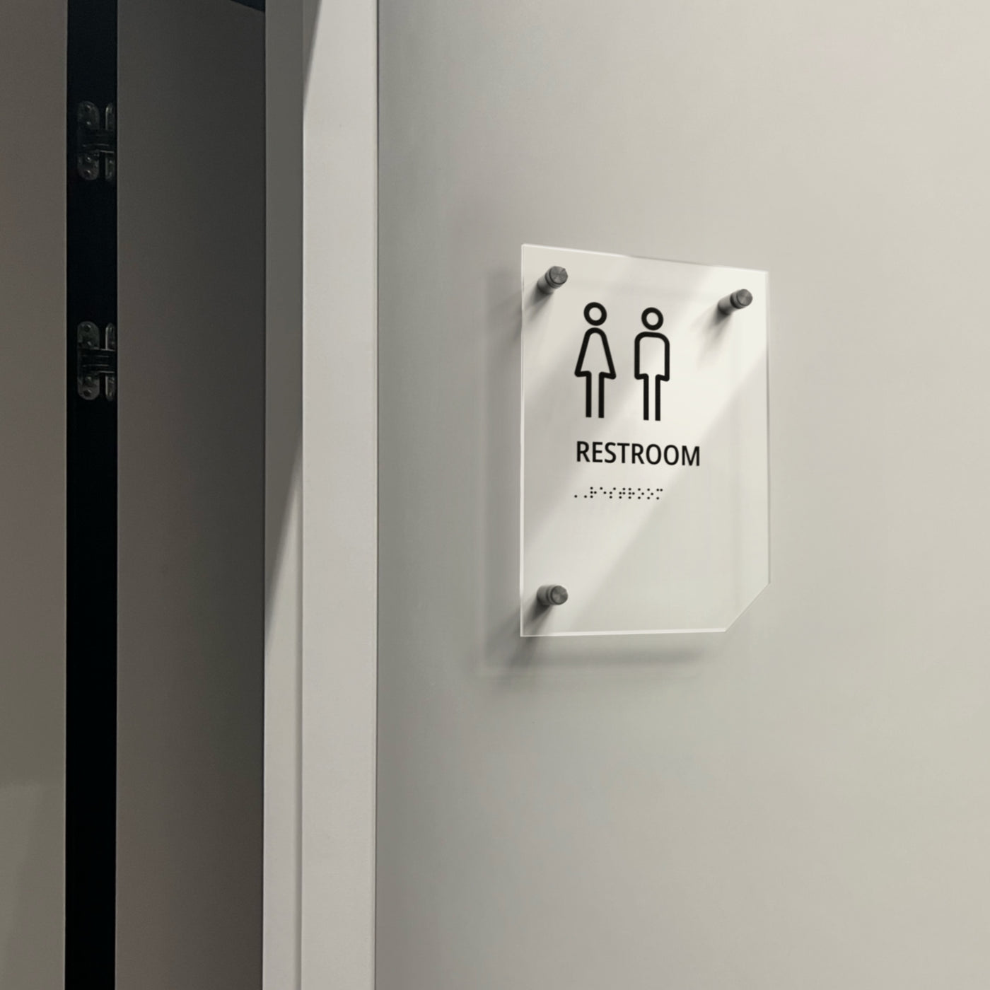 a restroom sign on the wall of a restroom