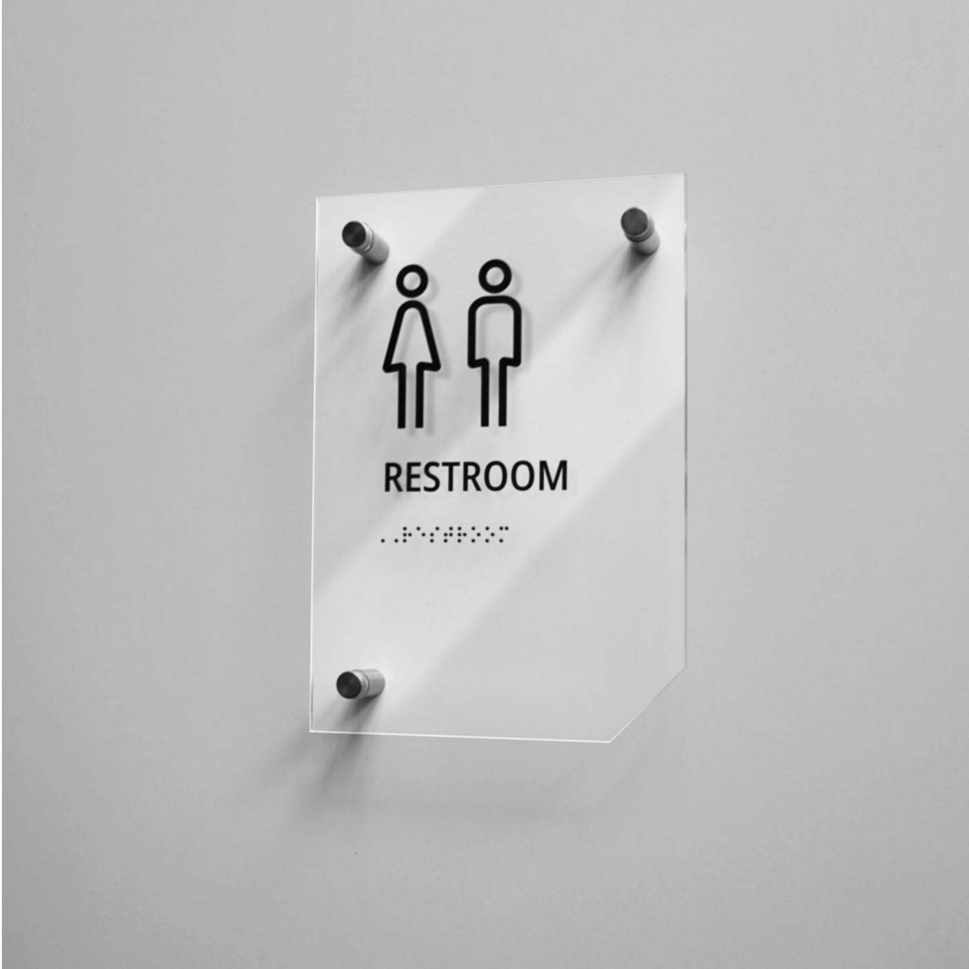 a restroom sign on a white wall